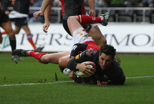 Gavin Henson, the Ospreys centre dives over to score the second try 