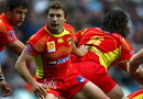 Chris Cusiter of Perpignan looks to feed the ball out 