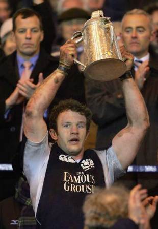 Scotland skipper Jason White lifts the Calcutta Cup after defeating England at Murrayfield, February 25 2006