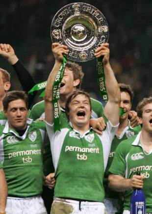 Ireland captain Brian O'Driscoll lifts the Triple Crown after his side defeated England at Twickenham, March 18 2006