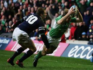 Ireland winger Denis Hickie dives in to score against Scotland at Murrayfield, February 12 2005