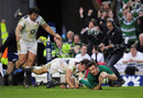 Ireland wing Tommy Bowe dives in to score