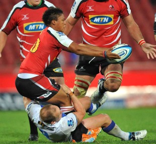 The Lions' Elton Jantjies looks to off load the ball, Lions v Western Force, Super Rugby, Ellis Park, Johannesburg, South Africa, March 19, 2011