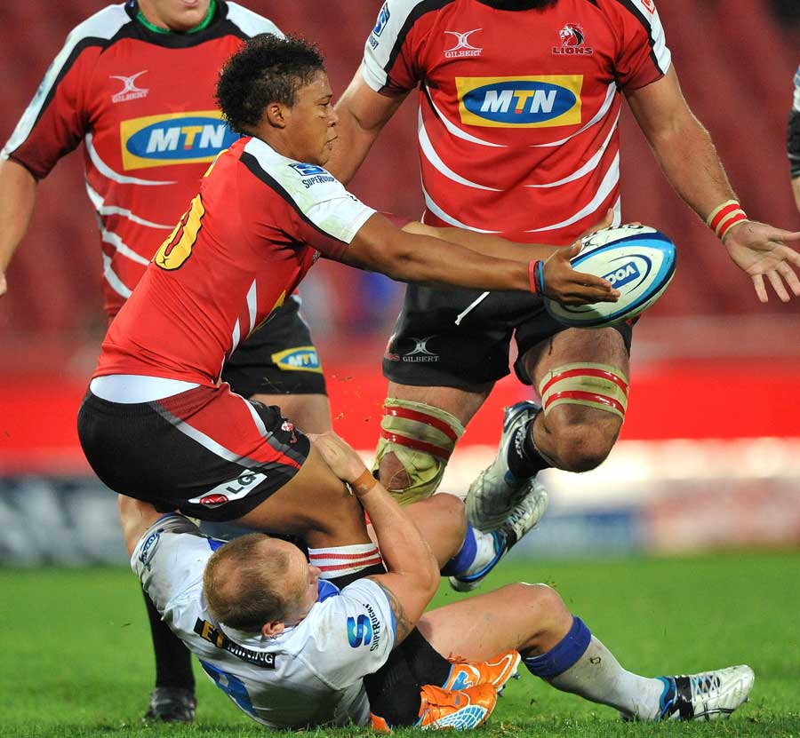 The Lions' Elton Jantjies looks to off load the ball