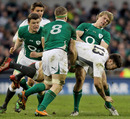 England's Matt Banahan is held by Ireland's defence
