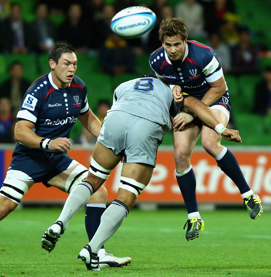 Melbourne Rebels fly-half Danny Cipriani is smashed by Victor Vito