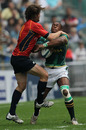 South Africa's Sibusiso Sithole wrestles with a Spanish defender