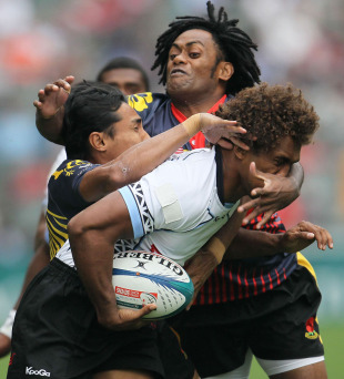 Fiji's Osea Kolinisau is collared by the Malaysian defence, IRB Sevens World Series, Hong Kong Stadium, Hong Kong, March 25, 2011