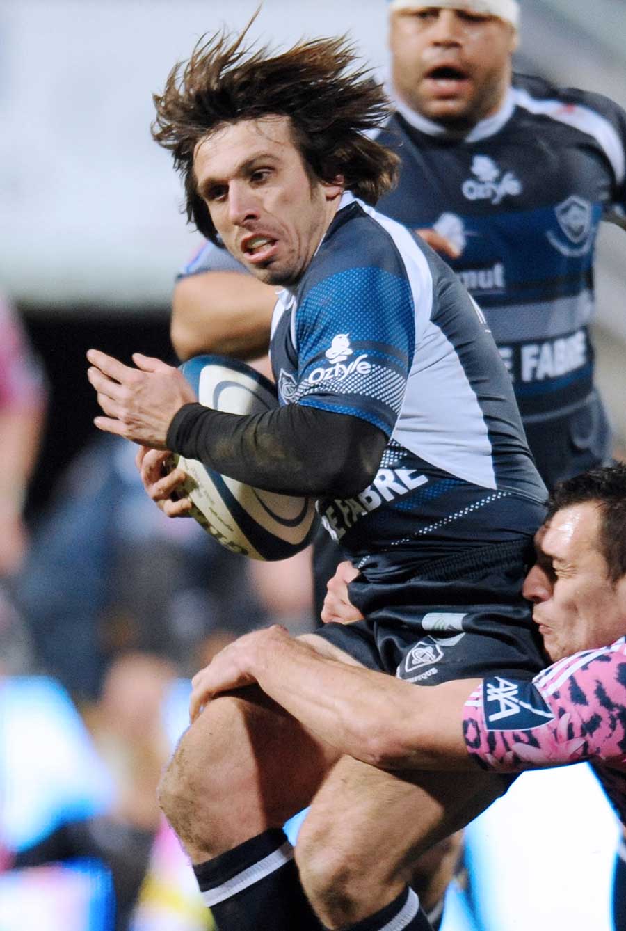 Castres' Romain Teulet works hard to protect the ball