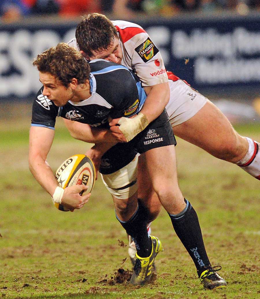 Glasgow's' Ruaridh Jackson is tackled by Ulster's Craig Gilroy 