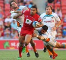 The Red's Digby Ioane breaches the Cheetahs' defence