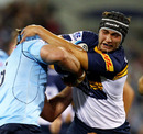 The Brumbies' Colby Faingaa is tackled during the clash with the Waratahs