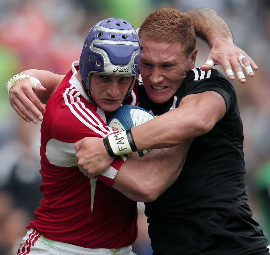 New Zealand's Declan O'Donnell and Frederico Oliveira of Portugal clash at the Hong Kong Sevens