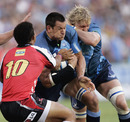 The Bulls' Pierre Spies barges into the Lions' defence