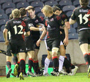Edinburgh wing Tim Visser is congratulated after his try