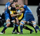 The Hurricanes' Jeremy Thrush is shackled by the Bulls' defence
