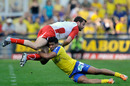 Biarritz fly-half Florian Faure is tackled by Wesley Fofana
