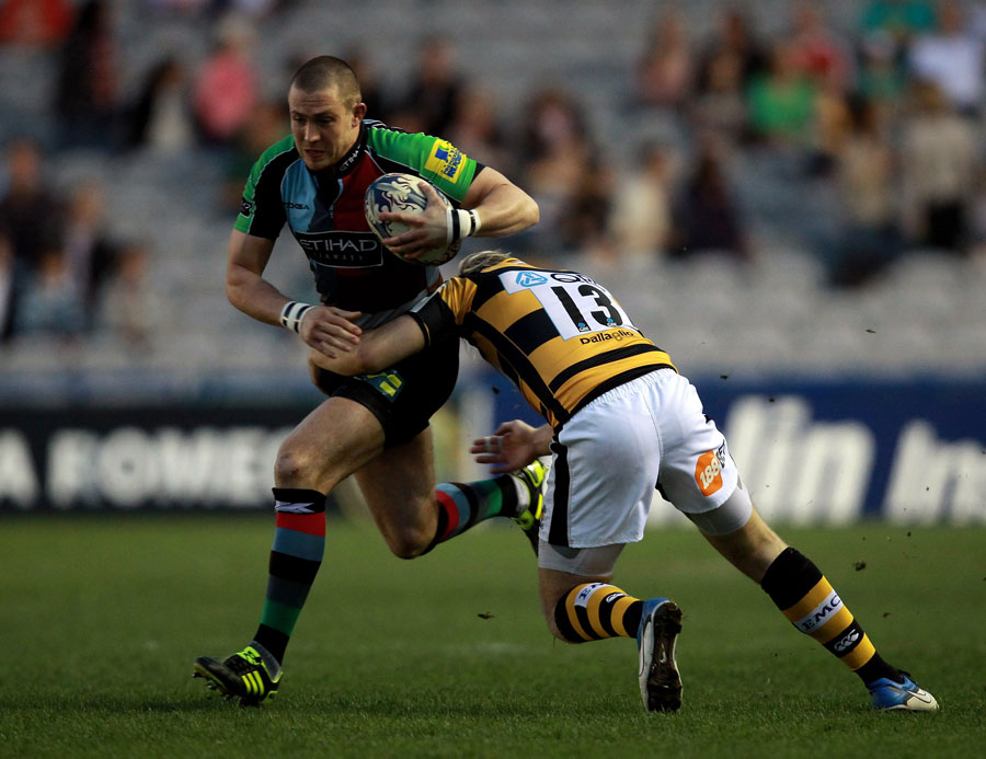 Harlequins fullback Mike Brown is tackled by Seb Jewell