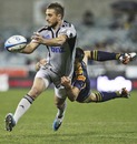 The Hurricanes' Andre Taylor evades the Brumbies' defence