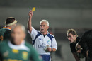 Referee Alan Lewis shows South Africa's Bakkies Botha a yellow card
