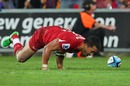 The Reds' Digby Ioane celebrates his try against the Bulls