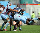 Bourgoin's Arnaud Tchougong flies into a tackle on Castres' Ibrahim Diarra