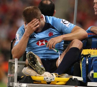 Waratahs winger Drew Mitchell reflects on a suspected ankle injury, Reds v Waratahs, Super Rugby, Suncorp Stadium, Brisbane, Australia, April 23, 2011