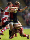 Saracens centre Chris Wyles takes the ball up against Gloucester