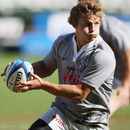 Patrick Lambie runs the ball during a Sharks training session