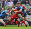 Toulouse centre Clement Poitrenaud is smashed by Brian O'Driscoll