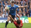 Leinster's Cian Healy steps over Toulouse's Cedric Heymans