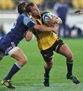 The Hurricanes' Aaron Cruden looks to force an opening