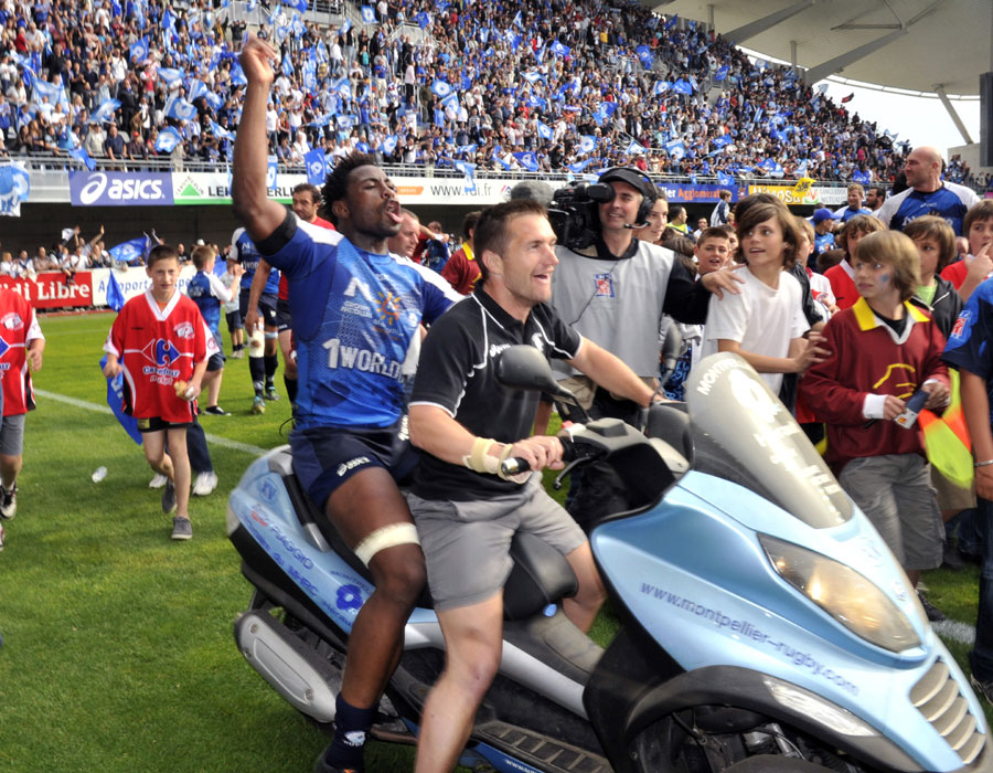 Montpellier flanker Fulgence Ouedraogo celebrates on a scooter