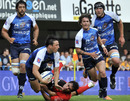 Montpellier fly-half Francios Trinh-Duc is caught by a Toulon tackler