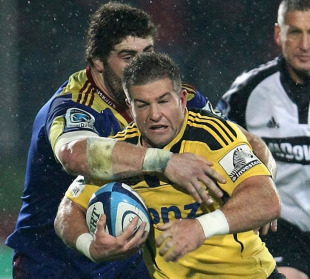 Hurricanes scrum-half Chris Eaton is caught by Jamie Mackintosh, Highlanders v Hurricanes, Super Rugby, Rugby Park, Invercargill, New Zealand, May 13, 2011