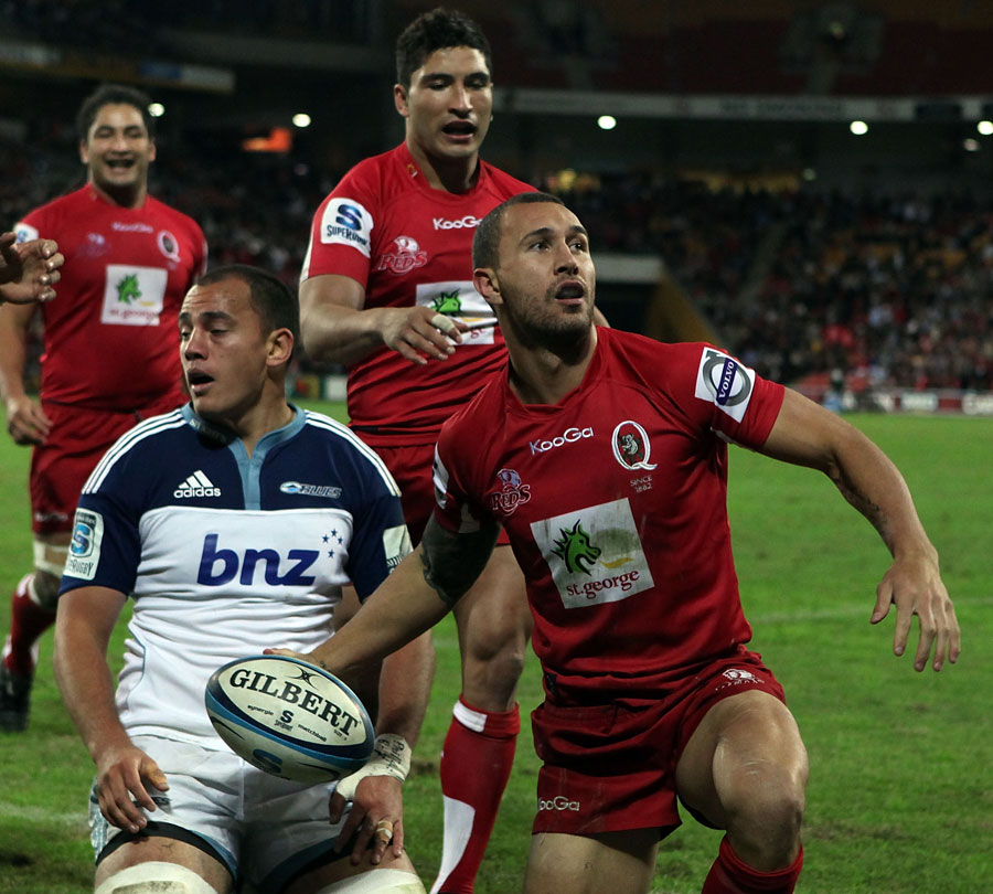 Reds fly-half Quade Cooper celebrates an early try