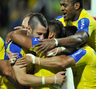 Clermont wing Julien Malzieu is mobbed by team-mates after his try, Clermont Auvergne v Biarritz, Top 14 play-offs, Stade Marcel Michelin, Clermont-Ferrand, France, May 13, 2011