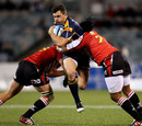 The Brumbies' Adam Ashley-Cooper is caught in a double tackle