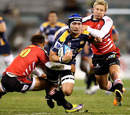 The Brumbies' Colby Faingaa is taken to the ground
