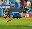 The Bulls' Wynand Olivier dives over