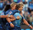 The Bulls' Wynand Olivier is congratulated after his try