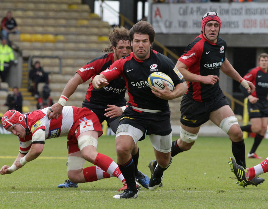 Saracens' Schalk Brits is felled by the Gloucester defence