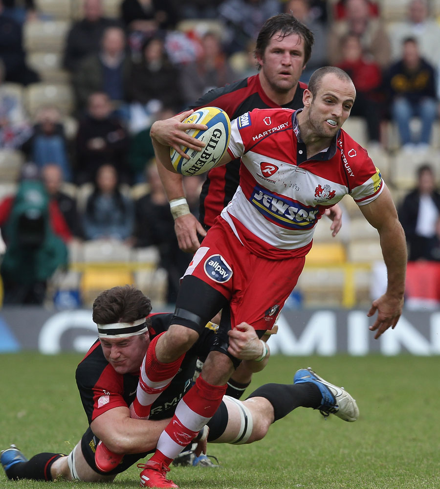 Gloucester's Charlie Sharples is caught by Saracens' Andy Saull