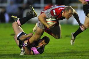 Mike Tindall (R) of Gloucester is tackled by Ollie Phillips (L) of Newcastle during the EDF Energy Cup match between Newcastle Falcons and Gloucester at Kingston Park in Newcastle, England on November 2, 2008.