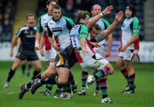 Harlequins scrum half Andy Gomarsall clears the ball despite the dive of Matt Mullan during the EDF Energy Cup match between Worcester Warriors and Harlequins at Sixways in Worcester, England  on November 2, 2008.