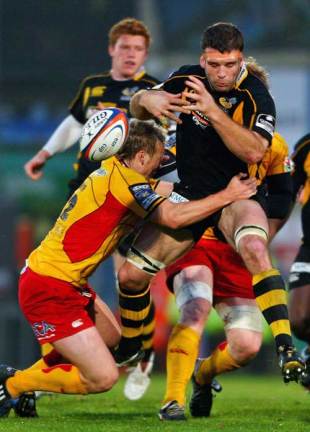 Joe Worsley of Wasps is tackled by Wayne Evans of Newport Gwent Dragons during the EDF Energy Anglo-Welsh Cup, Group A match between London Wasps and Newport Gwent Dragons at Adams Park in High Wycolme, England on November 2, 2008. 