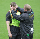 Northampton coach Dorian West inspects Chris Ashton's head wound