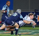 Johann Sadie dives in to score for the Stormers despite the presence of the Blues' Joe Rokocoko and Lachie Munro