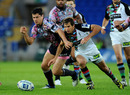 Stade Francais centre Guilliaume Bousses and Quins wing Gonzalo Camacho battle for a loose ball
