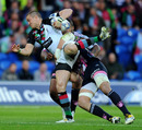 Harlequins fullback Mike Brown is tackled by Sergio Parisse
